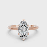 Rose gold Marquise Cut Diamond Solitaire Ring with Six-Prong Setting and Classic Band