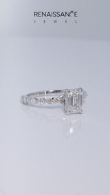 Silver Emerald Cut Diamond Ring with Marquise and Round  Side Stones and Four-Prong Setting