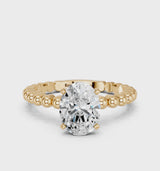 Yellow gold Oval Cut Diamond Solitaire Ring with Beaded Band and Prong Setting