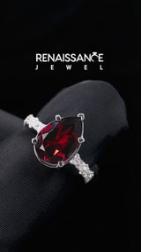 Silver Pear Cut Garnet Side Stone Solitaire Ring with Round and Four-Prong Setting