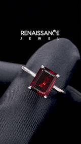 Silver Emerald Cut Garnet Solitaire Engagement Ring with Round Band and Four-Prong Setting