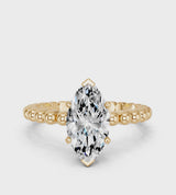 Yellow gold Marquise Cut Diamond Solitaire Ring with Beaded Band and Prong Setting