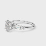 White gold Oval Cut Diamond Ring with Baguette Side Stones, Channel Set Band, and Four-Prong Setting