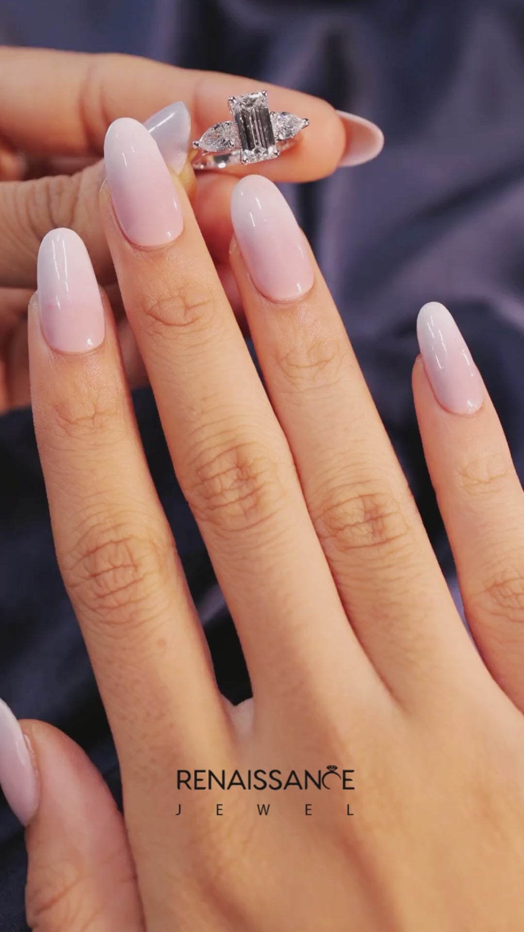 Platinum Three-Stone Emerald Cut Diamond Ring with Pear Side Stones on a Platinum Band and Four-Prong Setting 4