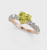 Rose gold Fancy Yellow Heart Cut Diamond Prong Setting with Side Stones on a Pave Band