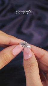 Silver Three-Stone Oval Cut Diamond Ring with Pear Side Stones and Four-Prong Setting