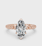 Rose gold Marquise Cut Diamond Solitaire Ring with Beaded Band and Prong Setting
