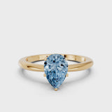 Yellow gold Fancy Blue Pear Cut Diamond Solitaire Ring with Six-Prong Setting and Classic Band