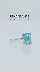 Silver Emerald Cut Blue Topaz Solitaire Engagement Ring with Round Band and Four-Prong Setting