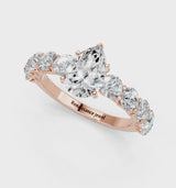 Rose gold Pear Cut Diamond Prong Setting with Side Stones on a Pave Band