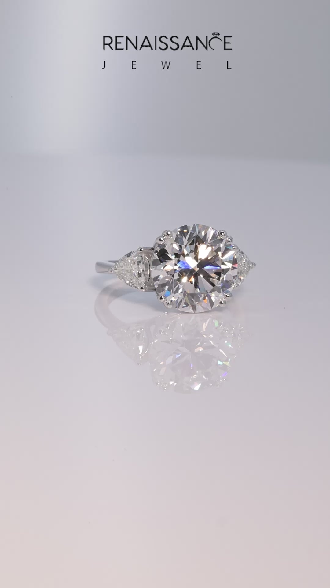 Platinum Round Brilliant and Trilliant Diamond Three-Stone Ring_65