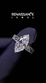 White gold Marquise Cut Diamond Solitaire Ring with Engraved Band and Four-Prong Setting