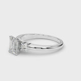White gold Three-Stone Emerald Cut Diamond Solitaire with Prong Setting and Classic Band