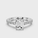 Platinum Emerald Cut Solitaire Diamond Engagement Ring with Pave Band and Four-Prong Setting