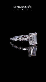 Silver Emerald Cut Diamond Ring with Marquise and Round  Side Stones and Four-Prong Setting