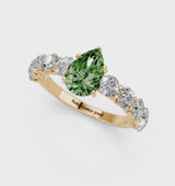 Yellow gold Fancy Green Pear Cut Diamond Prong Setting with Side Stones on a Pave Band