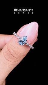 White gold Fancy Blue Pear Cut Diamond Prong Set Engagement Ring with Pavé Band