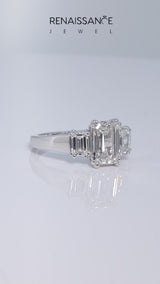 Platinum Three-Stone Emerald Cut Diamond Ring with Channel Set Band and Four-Prong Setting