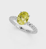 Platinum Fancy Yellow Oval Cut Diamond Solitaire Ring with Beaded Band and Prong Setting