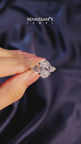 Yellow gold Three-Stone Oval Cut Diamond Ring with Pear Side Stones and Four-Prong Setting