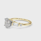 Yellow gold Oval Cut Diamond Ring with Baguette Side Stones, Channel Set Band, and Four-Prong Setting