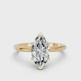 Yellow gold Marquise Cut Diamond Solitaire Ring with Six-Prong Setting and Classic Band