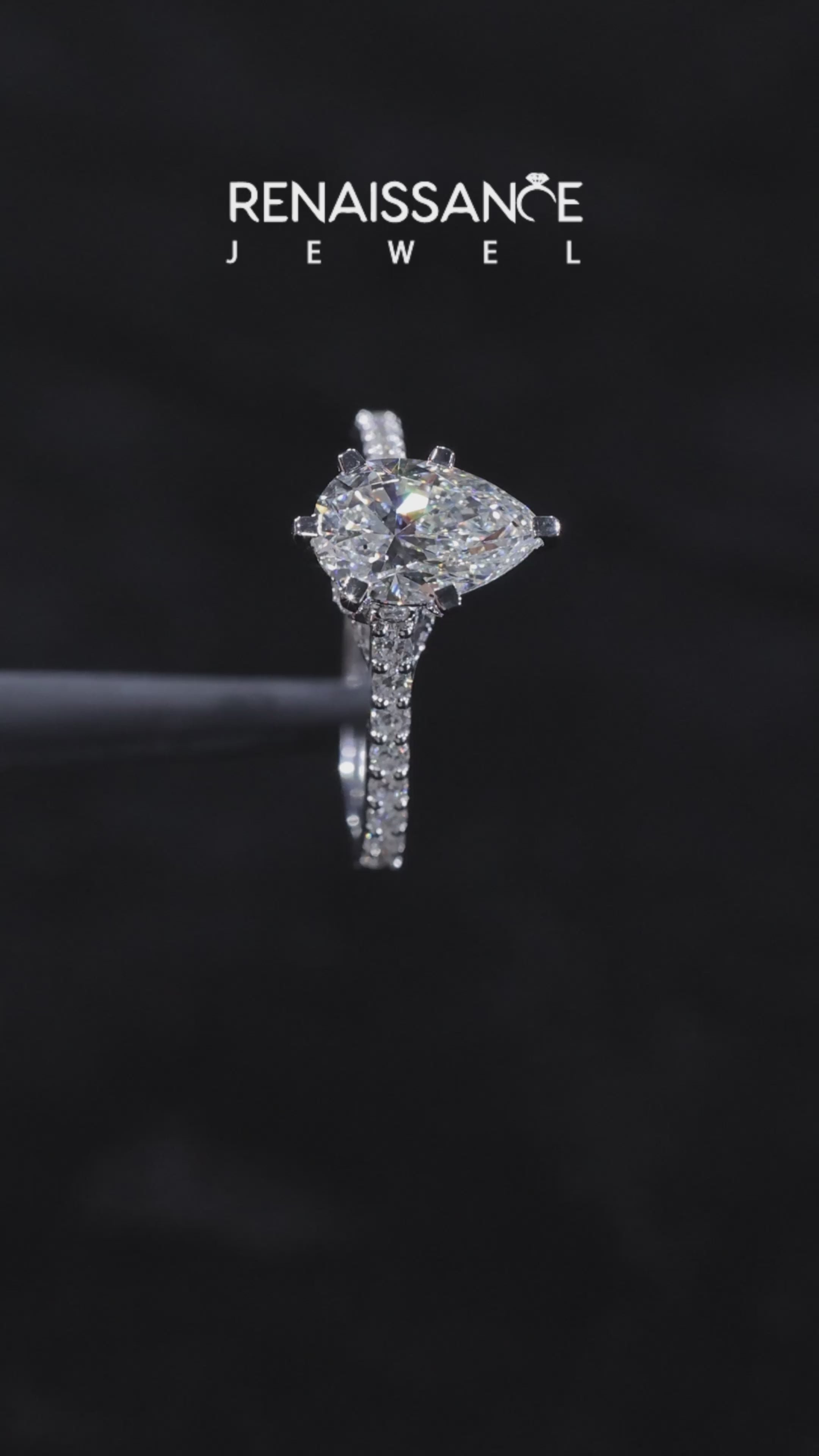 Silver Pear Solitaire Diamond Ring with Pavé Band and Four-Prong Setting 6