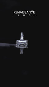 White gold Emerald Solitaire with Tapered Baguette Side Stones on a Classic Band with Four-Prong Setting