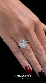 Silver Pear Solitaire with Tapered Baguette Side Stones on a Classic Band with Six-Prong Setting