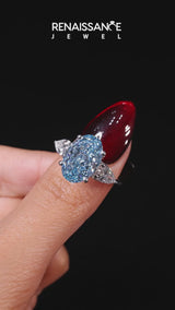 White gold Fancy Blue Oval Cut Diamond Three-Stone Ring with Pear  Side Stones and Prong Setting