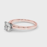 Rose gold Round Solitaire Diamond Engagement Ring with Four-Prong Setting on a Classic Band