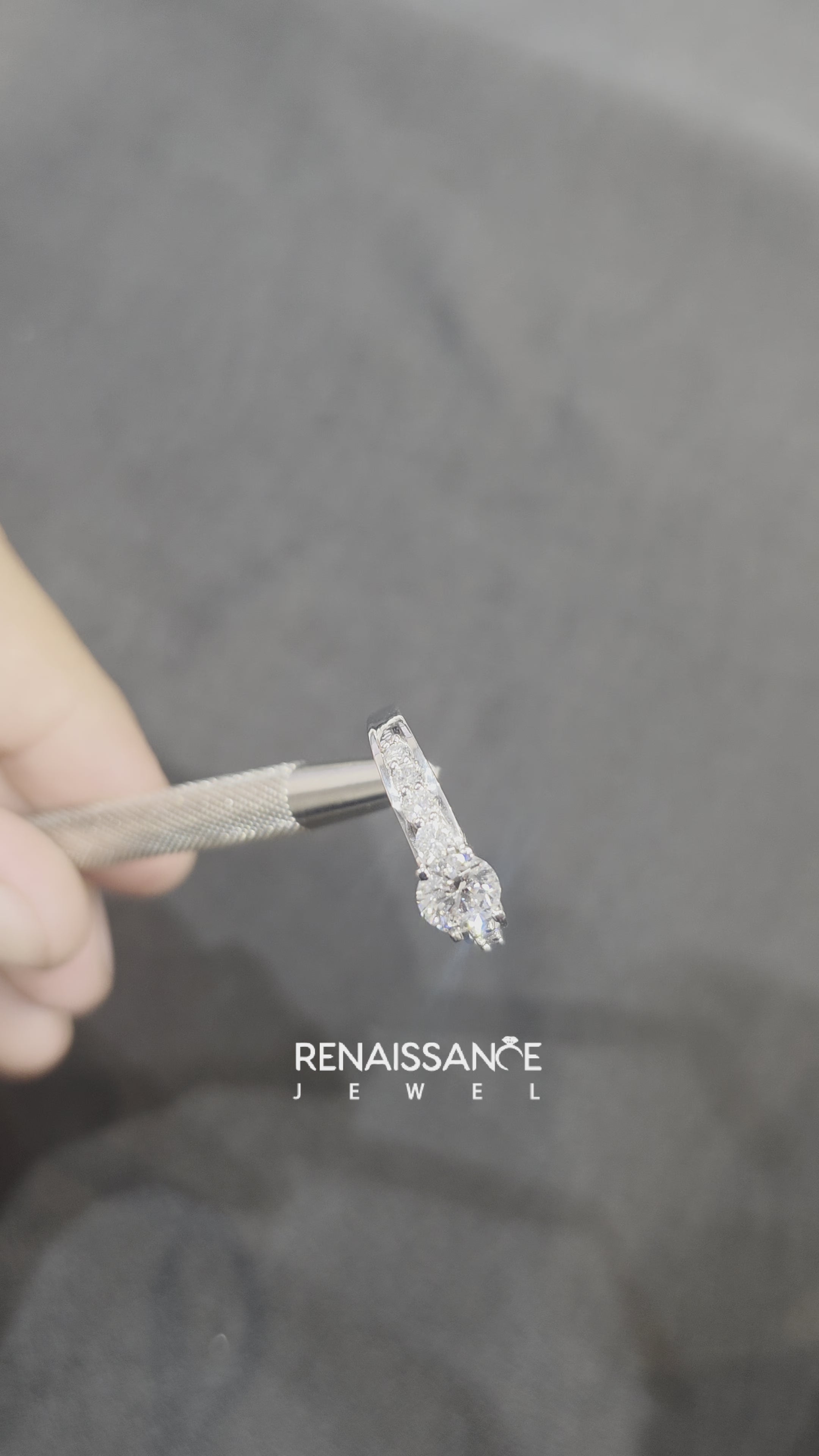 Silver Round Brilliant Solitaire with Side Stones on a Pave Band and Four-Prong Setting 3