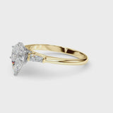 Yellow gold Pear Solitaire with Tapered Baguette Side Stones on a Classic Band with Six-Prong Setting