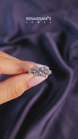 White gold Three-Stone Emerald Cut Cut Diamond Ring with Trillion Side Stones and Four-Prong Setting