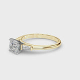 Yellow gold Cushion Solitaire with Tapered Baguette Side Stones on a Classic Band with Four-Prong Setting