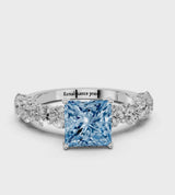 Silver Fancy Blue Princess Cut Diamond Prong Setting with Side Stones on a Pave Band