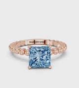 Rose gold Fancy Blue Princess Cut Diamond Solitaire Ring with Beaded Band and Prong Setting