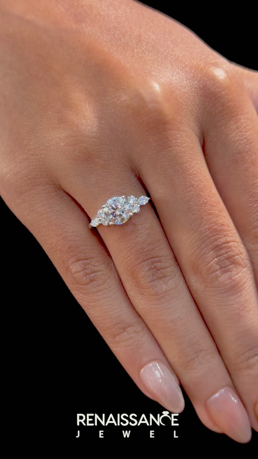 Silver Round Brilliant Diamond Solitaire Ring with Pear Side Stones and Four-Prong Setting_23