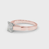 Rose gold Emerald Solitaire Engagement Ring with Four-Prong Setting and Tapered Band