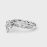 White gold Pear Solitaire Diamond Ring with Channel-Set Baguette Band and Four-Prong Setting