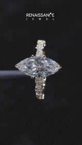 Yellow gold Marquise Cut Diamond Side Stone Solitaire Ring with Round  and Four-Prong Setting