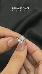 Platinum Pear Cut Diamond Solitaire Engagement Ring with Round Band and Four-Prong Setting