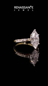 Yellow gold Marquise Cut Diamond Solitaire with Side Baguettes and Channel Set Band