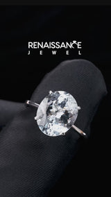 Silver Oval Cut Aquamarine Solitaire Engagement Ring with Classic Band and Four-Prong Setting