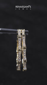 Yellow gold Round Diamond Pavé Bamboo Hoop Earrings with Four-Prong Setting