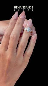 Yellow gold Three-Stone Marquise Cut Diamond Ring with Pear Side Stones and Four-Prong Setting