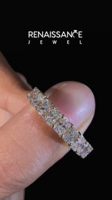 Yellow gold radiant cut diamond eternity band with shared prong setting