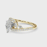 Yellow gold Pear Solitaire with Pavé Twist Band and Four-Prong Setting
