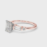 Rose gold Emerald Cut Diamond Ring with Baguette Side Stones, Channel Set Band, and Four-Prong Setting
