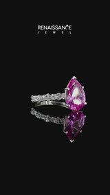 Silver Pear Cut Pink Sapphire Side Stone Solitaire Ring with Round and Four-Prong Setting